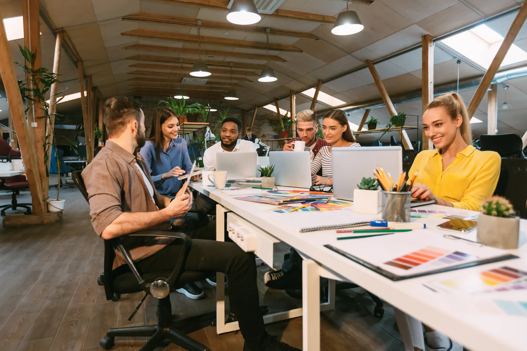 Collaborative learning design team working in a modern office